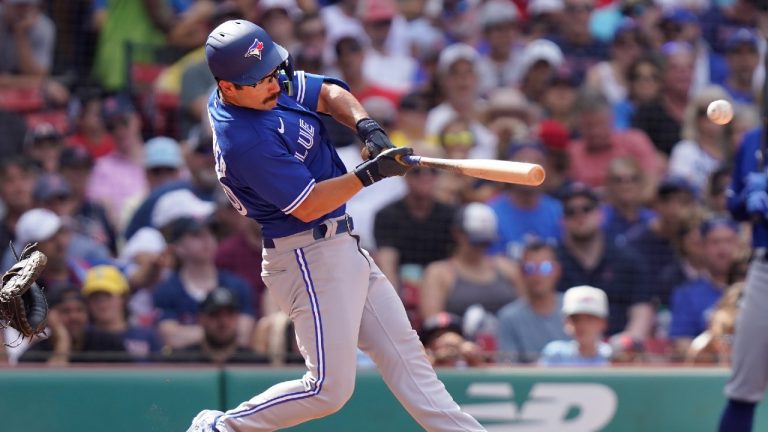 Toronto Blue Jays' Davis Schneider hits a one-run single allowing Brandon Belt to score in the seventh inning of a baseball game against the Boston Red Sox, Sunday, Aug. 6, 2023, in Boston. (Steven Senne/AP)