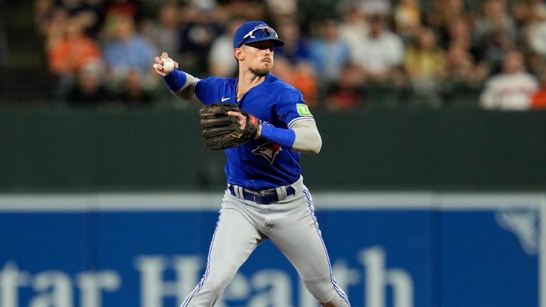 Toronto Blue Jays second baseman Cavan Biggio throws to first base on a groundout by the Baltimore Orioles during the second inning of a baseball game, Thursday, Aug. 24, 2023, in Baltimore. (Julio Cortez/AP)