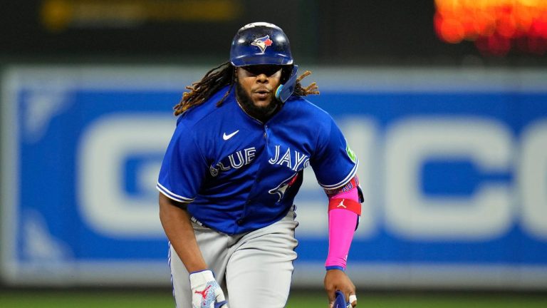 Toronto Blue Jays' Vladimir Guerrero Jr. tags up to third base against the Baltimore Orioles during the 10th inning of a baseball game, Tuesday, Aug. 22, 2023, in Baltimore. The Blue Jays won 6-3. (Julio Cortez/AP Photo)