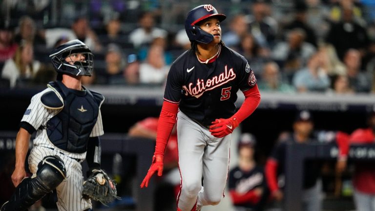 Washington Nationals' CJ Abrams, right, and New York Yankees catcher Ben Rortvedt watch Abrams' home run during the eighth inning of a baseball game Tuesday, Aug. 22, 2023, in New York. (Frank Franklin II/AP)