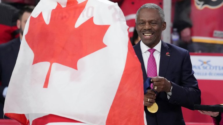 Hugh Fraser, Hockey Canada Board Chair, prepares the gold medals during the medal ceremony of the IIHF World Junior Hockey Championship gold medal game in Halifax on Thursday, January 5, 2023. THE CANADIAN PRESS/Darren Calabrese