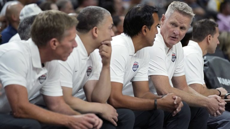 United States head coach Steve Kerr, fourth from left, speaks with assistant coach Erik Spoelstra, third from left, during the first half of an exhibition basketball game against Puerto Rico, Monday, Aug. 7, 2023, in Las Vegas. (John Locher/AP)