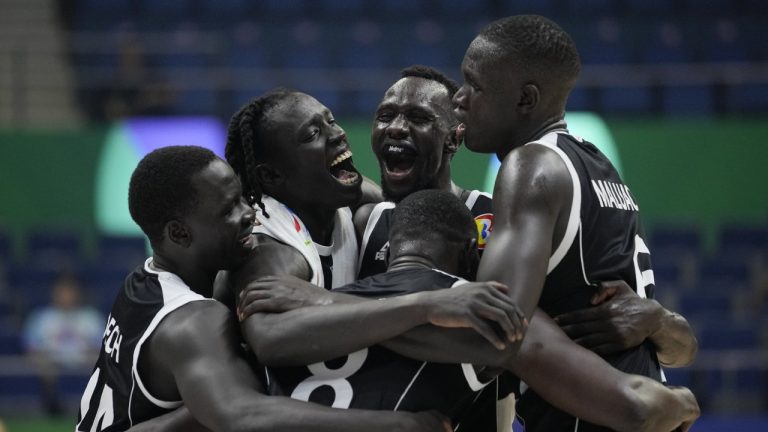 South Sudan players celebrate after winning against China during their Basketball World Cup group B match at the Araneta Coliseum in Manila, Philippines Monday, Aug. 28, 2023. (Aaron Favila/AP)