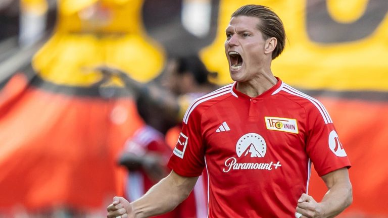 Berlin's Kevin Behrens celebrates after scoring, during the German Bundesliga soccer match between 1. FC Union Berlin and 1. FSV Mainz, at the Stadion An der Alten Forsterei, in Berlin, Sunday, Aug. 20, 2023. (Andreas Gora/dpa via AP)