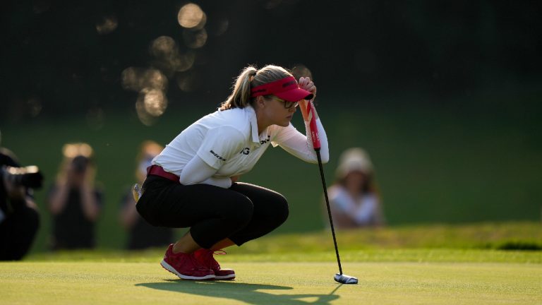 Brooke Henderson, of Canada, lines up a putt on the 17th hole during the third round at the LPGA CPKC Canadian Women's Open golf tournament, in Vancouver, on Saturday, August 26, 2023. (Darryl Dyck/CP)