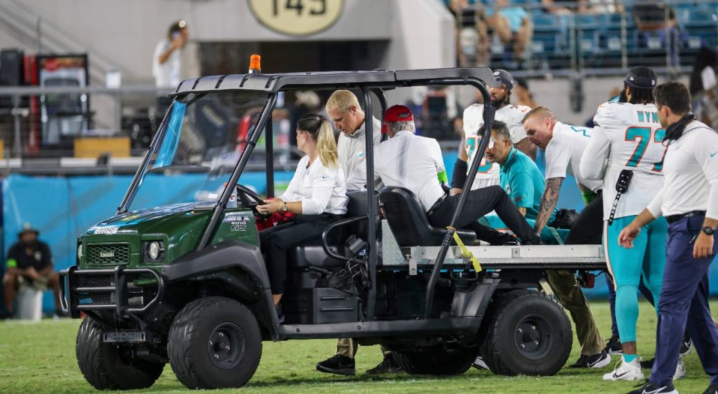 Daewood Davis of Dolphins carted off field after collision; preseason game  vs. Jaguars halted