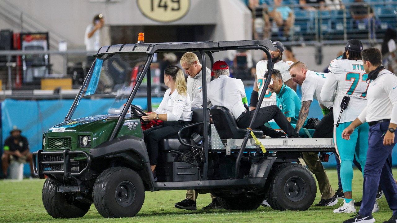 Daewood Davis of Dolphins carted off field after collision; preseason game  vs. Jaguars halted