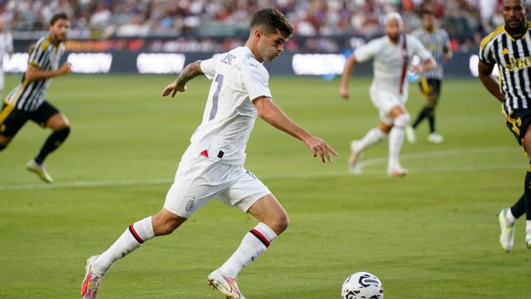 AC Milan forward Christian Pulisic (11) shoots during the first half of a Champions Tour soccer match against Juventus FC. (Ashley Landis/AP)