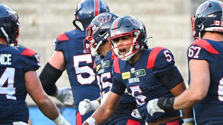 Montreal Alouettes quarterback Caleb Evans (5) reacts after scoring a touchdown during first half CFL football action against the Saskatchewan Roughriders in Montreal, Friday, August 11, 2023. (Graham Hughes/THE CANADIAN PRESS)