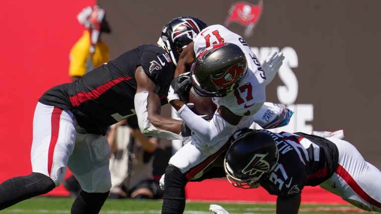 Tampa Bay Buccaneers wide receiver Russell Gage (17) is hit by Atlanta Falcons cornerback Dee Alford (37) and Atlanta Falcons linebacker Mykal Walker (3) during the first half of an NFL football game Sunday, Oct. 9, 2022, in Tampa, Fla. (AP)