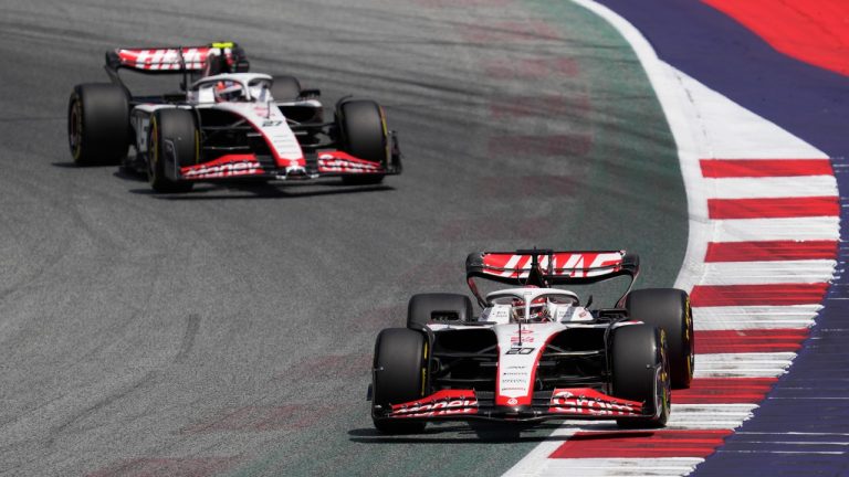 Haas driver Kevin Magnussen, right, of Denmark, steers his car followed by his teammate Haas driver Nico Hulkenberg of Germany during the first practice session ahead of Sunday's Formula One Austrian Grand Prix auto race, at the Red Bull Ring racetrack, in Spielberg, Austria, Friday, June 30, 2023. (Darko Vojinovic/AP)