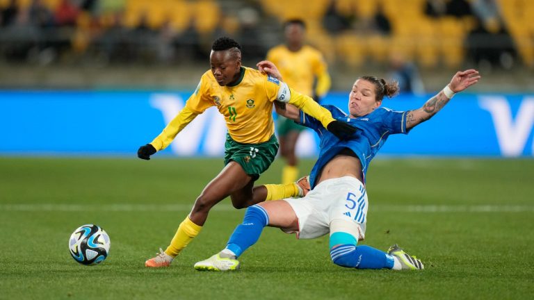 South Africa's Thembi Kgatlana, left, fights for the ball against Italy's Elena Linari during the Women's World Cup Group G soccer match between South Africa and Italy in Wellington, New Zealand, Wednesday, Aug. 2, 2023. (Alessandra Tarantino/AP)