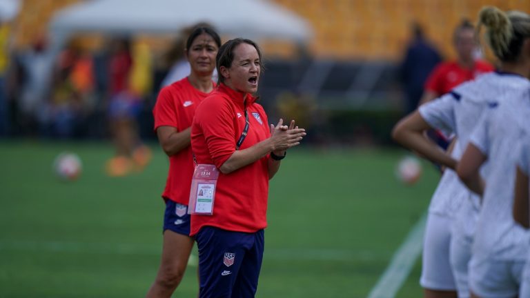 Twila Kilgore, assistant coach on the U.S. team applauds as players warm up prior to a CONCACAF Women's Championship soccer semifinal match against Costa Rica in Monterrey, Mexico, Thursday, July 14, 2022. (Fernando Llano/AP)