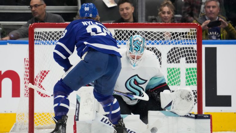 Seattle Kraken goaltender Martin Jones (30) stops Toronto Maple Leafs right wing William Nylander (88) during first period NHL hockey action in Toronto. (Frank Gunn/THE CANADIAN PRESS)