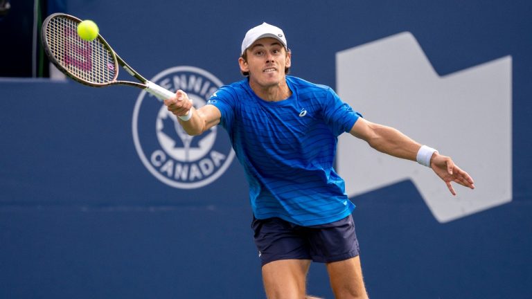 Alex de Minaur of Australia hits a return on his way to defeating Daniil Medvedev of Russia in quarterfinal tennis action at the National Bank Open in Toronto, Friday, Aug. 11, 2023. (Frank Gunn/CP)