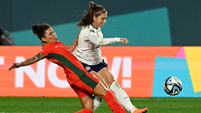 United States' Alex Morgan, right, attempts a shot as Portugal's Ana Borges blocks during the Women's World Cup Group E soccer match between Portugal and the United States at Eden Park in Auckland, New Zealand, Tuesday, Aug. 1, 2023. (Andrew Cornaga/AP)