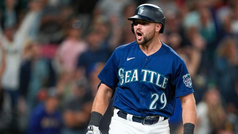 Seattle Mariners' Cal Raleigh celebrates his two-run home run against the San Diego Padres during the eighth inning of a baseball game, Wednesday, Aug. 9, 2023, in Seattle. (Lindsey Wasson/AP Photo)