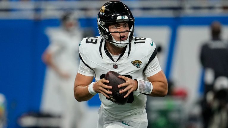 Jacksonville Jaguars quarterback Nathan Rourke (18) runs out of the pocket against the Detroit Lions during the second half of a preseason NFL football game, Saturday, Aug. 19, 2023, in Detroit. (Paul Sancya/AP)