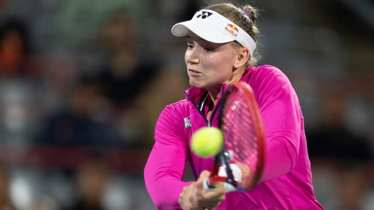 Elena Rybakina of Kazakhstan, hits a return to Daria Kasatkina of Russia, during quarterfinal action at the National Bank Open tennis tournament in Montreal, Friday, Aug.11, 2023. (Christinne Muschi/CP)