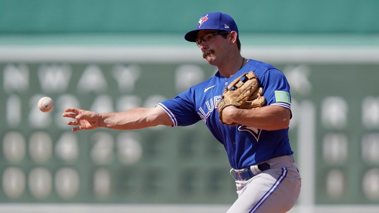 Toronto Blue Jays' Davis Schneider throws to first to retire Boston Red Sox's Yu Chang in the fifth inning of a baseball game, Sunday, Aug. 6, 2023, in Boston. (Steven Senne/AP Photo)