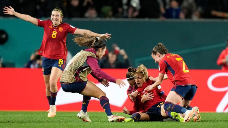 Spain's Olga Carmona celebrates by her teammates after she scored her side's winning goal during the Women's World Cup semifinal soccer match between Sweden and Spain at Eden Park in Auckland, New Zealand, Tuesday, Aug. 15, 2023. (Alessandra Tarantino/AP Photo)