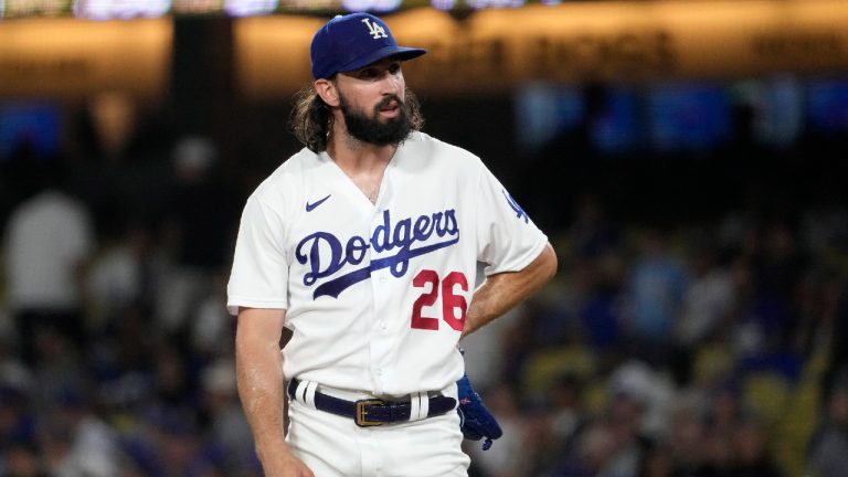 Los Angeles Dodgers starting pitcher Tony Gonsolin stands on the mound as manager Dave Roberts comes to take him out during the fourth inning of a baseball game against the Miami Marlins Friday, Aug. 18, 2023, in Los Angeles. (Mark J. Terrill/AP)