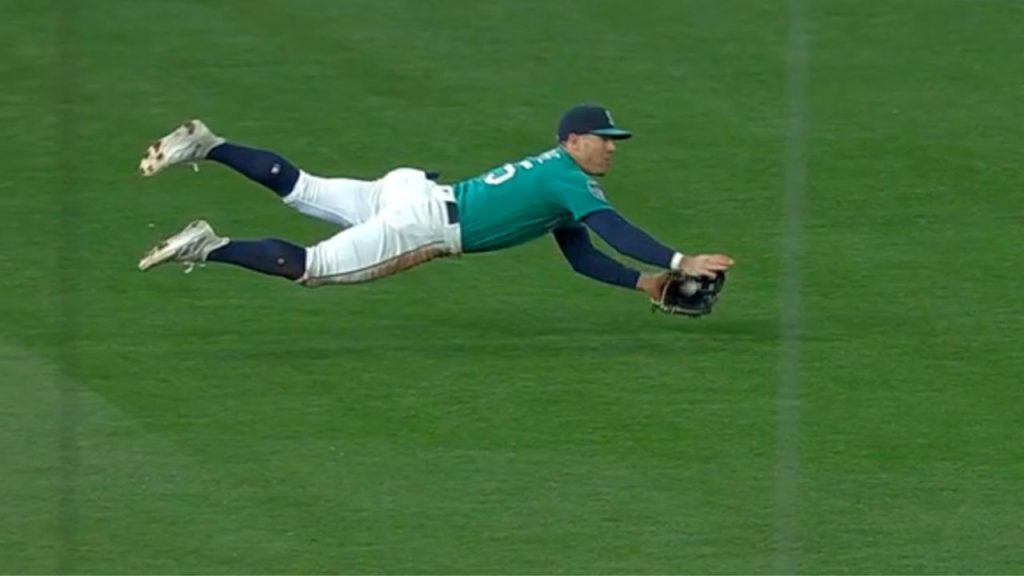  Baseball Player Diving to Catch Ball in Stadium Photo