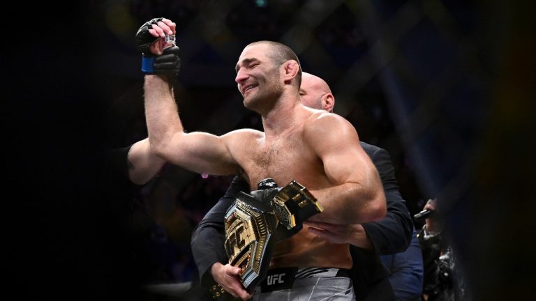 American Sean Strickland celebrates defeating Nigerian-born New Zealander Israel Adesanya to claim the middleweight title by unanimous decision in the main event of UFC 293 in Sydney, Sunday, Sept. 10, 2023. (Dan Himbrechts/AAP Image via AP)