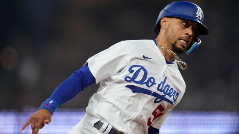 Los Angeles Dodgers' Mookie Betts (50) rounds third while scoring off of a double hit by J.D. Martinez during the third inning of a baseball game against the San Francisco Giants in Los Angeles, Saturday, Sept. 23, 2023. Max Muncy also scored. (Ashley Landis/AP)