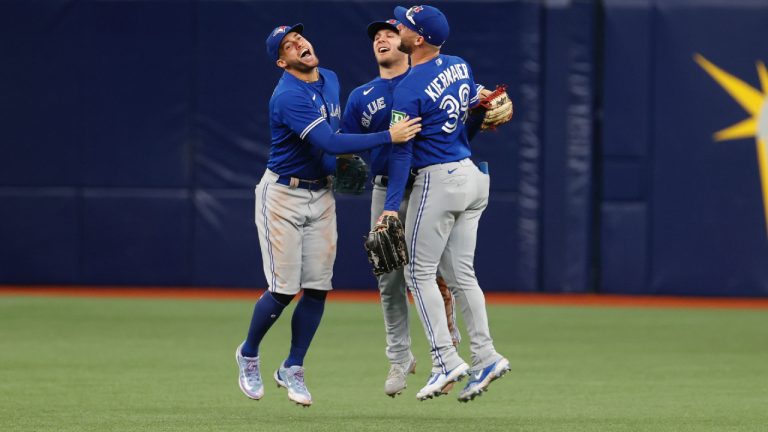 Toronto Blue Jays outfielder's George Springer, left, Daulton Varsho, centre and Kevin Kiermaier celebrate after a game against the Tampa Bay Rays on Sunday, Sept. 24, 2023, in St. Petersburg, Fla. (Scott Audette/AP)