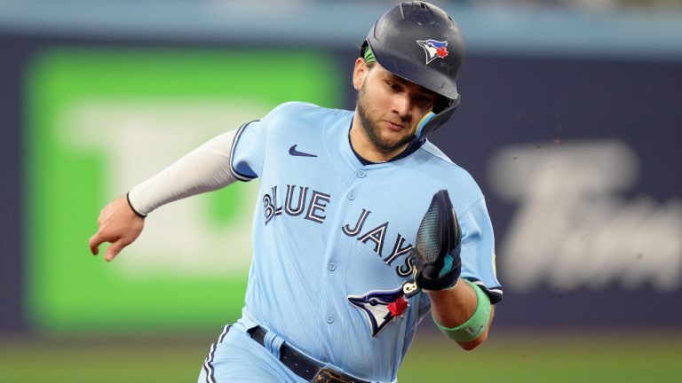 Toronto Blue Jays shortstop Bo Bichette (11) rounds the bases on his way to scoring on a hit by teammate Cavan Biggio, not shown, during the fifth inning MLB baseball action against the New York Yankees, in Toronto, Thursday, Sept. 28, 2023. (Chris Young/CP)