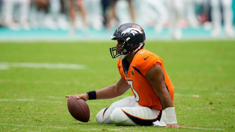 Denver Broncos quarterback Russell Wilson (3) sits on the field after he was sacked during the second half of an NFL football game against the Miami Dolphins, Sunday, Sept. 24, 2023, in Miami Gardens, Fla. The Dolphins defeated the Broncos 70-20. (Rebecca Blackwell/AP)