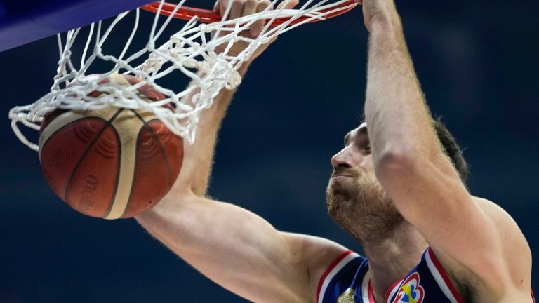 Serbian centre Nikola Milutinov (33), seen here, said his team was very affected by the fact teammate Borisa Simanic had to have a kidney removed at the FIBA World Cup. (Aaron Favila/AP) 