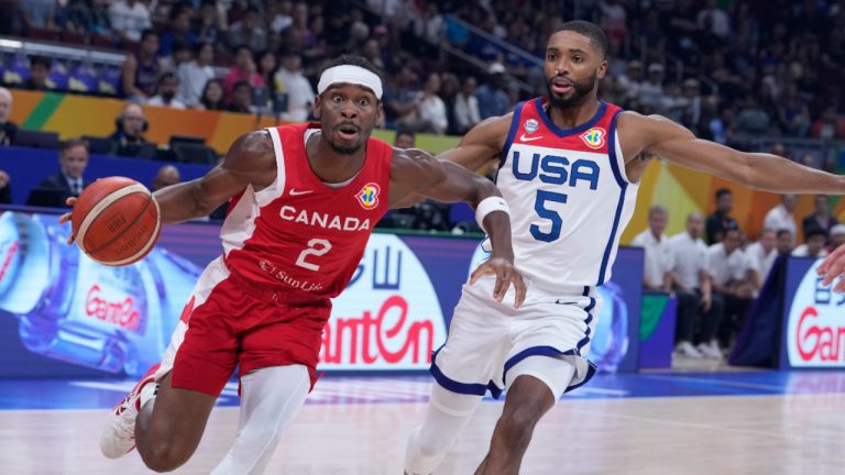 Canada guard Shai Gilgeous-Alexander (2) dribbles past U.S. forward Mikal Bridges (5) during the Basketball World Cup bronze medal game between the United States and Canada in Manila, Philippines, Sunday, Sept. 10, 2023. (Michael Conroy/AP) 