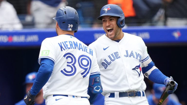 Toronto Blue Jays centre fielder Kevin Kiermaier (39) celebrates with teammate George Springer after hitting a solo home run against the Kansas City Royals during seventh inning American League baseball action in Toronto on Sunday, Sept.10, 2023. (Nathan Denette/CP)