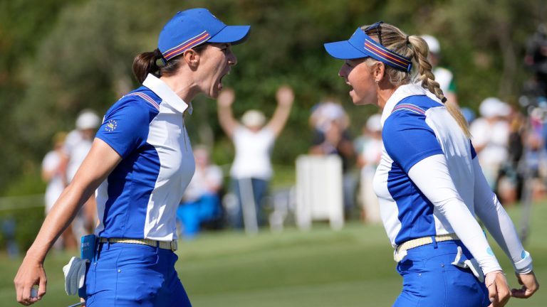 Europe's Carlota Ciganda, right and playing partner Emily Kristine Pedersen celebrate on the 17th green after defeating the United States team of Lilia Vu and Jennifer Kupcho, 2 and 1 in their morning foursome at the Solheim Cup golf tournament in Finca Cortesin, near Casares, southern Spain, Saturday, Sept. 23, 2023. (Bernat Armangue/AP) 