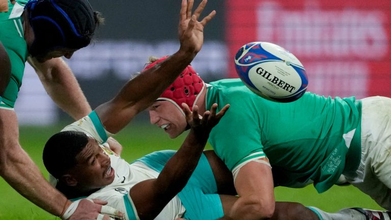 South Africa's Damian Willemse, left, is tackled by Ireland's Josh van der Flier during the Rugby World Cup Pool B match between South Africa and Ireland at the Stade de France in Saint-Denis, outside Paris, Saturday, Sept. 23, 2023. (Christophe Ena/AP) 