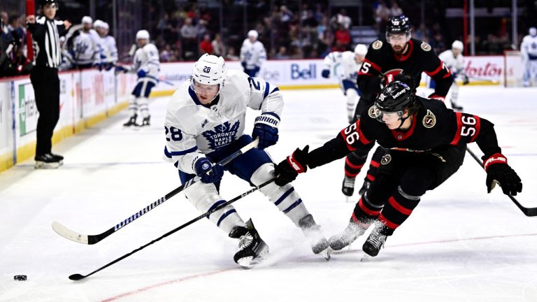 Toronto Maple Leafs' Sam Lafferty (28) and Ottawa Senators' Jorian Donovan (56) chase the puck during first period irst period NHL preseason hockey action in Ottawa, on Sunday, Sept. 24, 2023. (Justin Tang/CP)