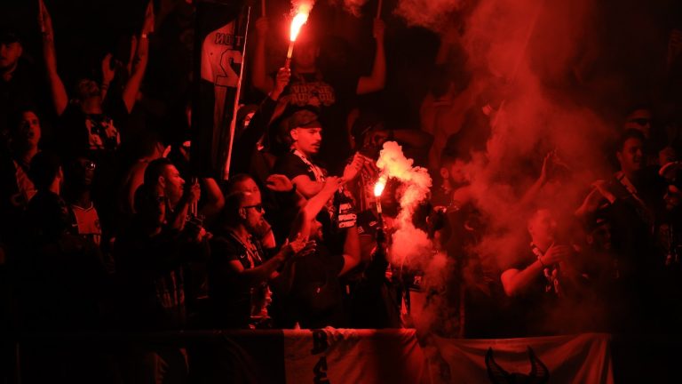 Fans light flares during the French League One soccer match between Paris Saint Germain and Olympique de Marseille at Parc des Princes stadium in Paris, France, Sunday, Sept. 24, 2023. (AP)