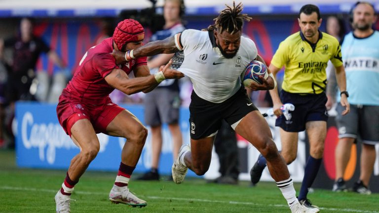 Fiji's Waisea Nayacalevu is tackled by Georgia's Akaki Tabutsadze during the Rugby World Cup Pool C match between Fiji and Georgia at the Stade de Bordeaux in Bordeaux, France, Saturday, Sept. 30, 2023. (Thibault Camus/AP) 