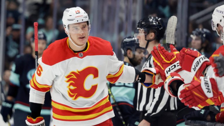 Calgary Flames defenseman Nikita Zadorov (16) is congratulated after scoring against the Seattle Kraken during the first period of an NHL hockey game, Friday, Jan. 27, 2023, in Seattle. (John Froschauer/AP) 