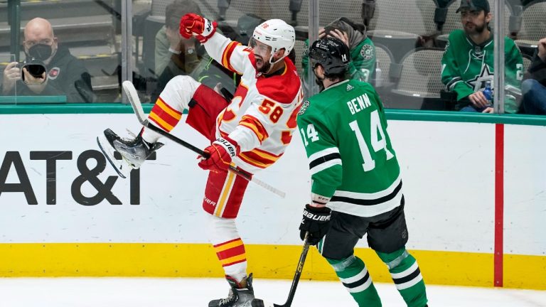 Calgary Flames defenseman Oliver Kylington (58) celebrates after scoring in front of Dallas Stars left wing Jamie Benn (14) in the third period of an NHL hockey game in Dallas, Tuesday, Feb. 1, 2022. (Tony Gutierrez/AP)