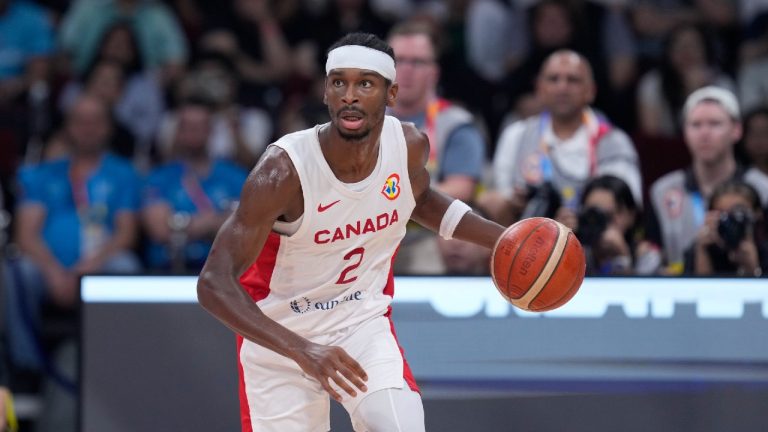 Canada's Shai Gilgeous-Alexander brings the ball down the court during the second half of a Basketball World Cup quarterfinal game against Slovenia in Manila, Philippines, Wednesday, Sept. 6, 2023. (Michael Conroy/AP)