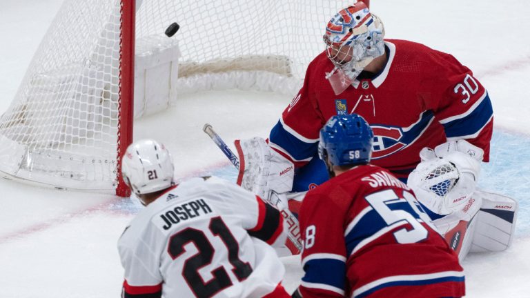 Ottawa Senators' Mathieu Joseph (21) scores on Montreal Canadiens Cayden Primeau (30) as teammate David Savard (58) skates in during second period NHL preseason hockey action in Montreal, Wednesday, Sept. 27, 2023. (Christinne Muschi/CP)