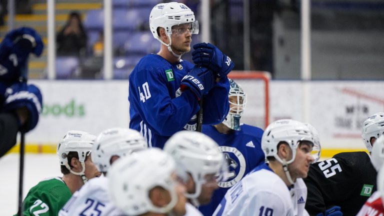 Vancouver Canucks' Elias Pettersson (40) listens during the opening day of the NHL hockey team's training camp, in Victoria, Thursday, Sept. 21, 2023. (Darryl Dyck/CP)