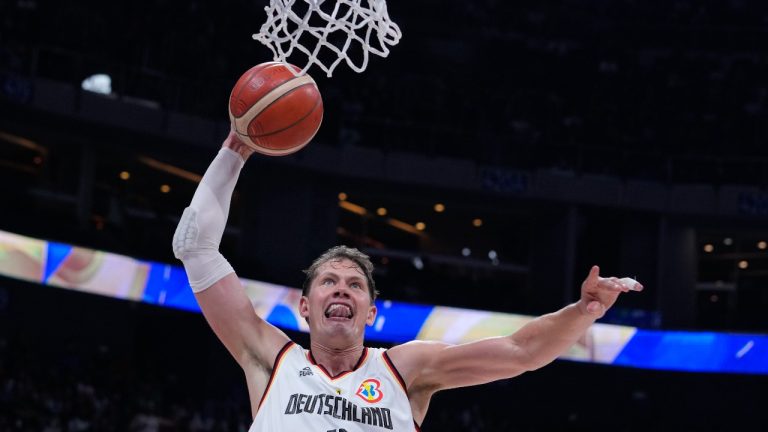 Germany forward Moritz Wagner (13) scores during the Basketball World Cup quarterfinal between Germany and Latvia in Manila, Philippines, Wednesday, Sept. 6, 2023. (Michael Conroy/AP Photo)