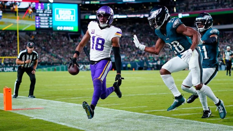 Minnesota Vikings wide receiver Justin Jefferson (18) runs out of bounds with the ball in front of Philadelphia Eagles cornerback Josh Jobe (28) during the first half of an NFL football game Thursday, Sept. 14, 2023, in Philadelphia. (Matt Rourke/AP)