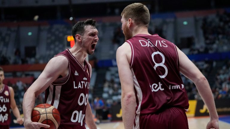 Latvia forward Rodions Kurucs (00) and Latvia forward Davis Bertans (8) react after scoring during the Basketball World Cup. (Achmad Ibrahim/AP)