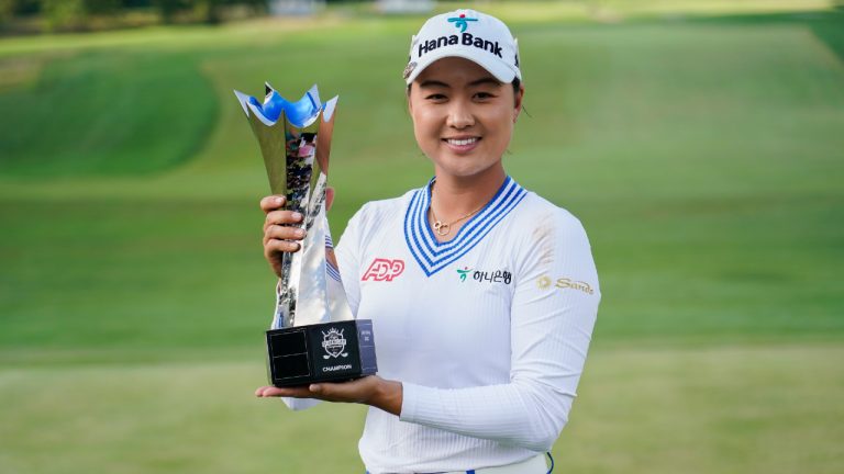 Minjee Lee holds the trophy after winning the LPGA Kroger Queen City Championship golf tournament, Sunday, Sept. 10, 2023, in Cincinnati. Lee finished at -17, defeating Charley Hull after two playoff holes. (Joshua A. Bickel/AP)