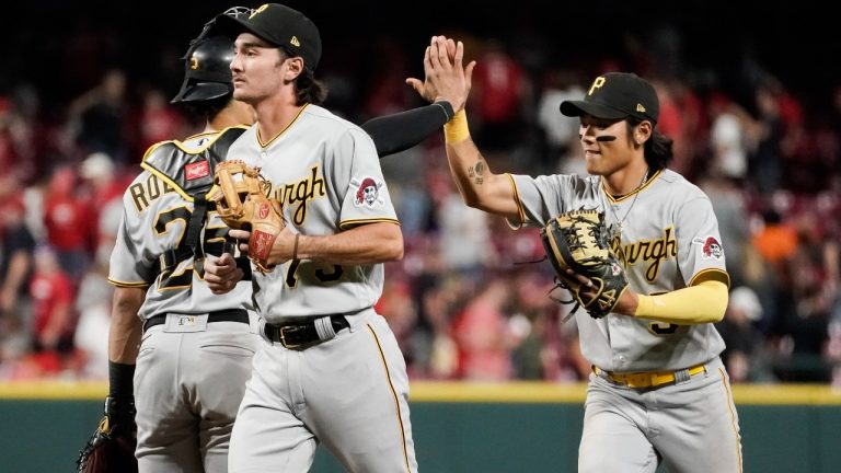 Pittsburgh Pirates' Ji Hwan Bae, right, celebrates with catcher Endy Rodriguez, left, after the team's 13-12 victory against the Cincinnati Reds in a baseball game Saturday, Sept. 23, 2023, in Cincinnati. (Joshua A. Bickel/AP)